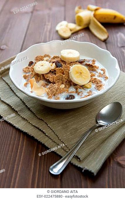 Breakfast cereals with milk and banana