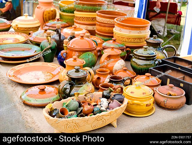 rustic handmade ceramic clay brown terracotta ware souvenirs at street handicraft market
