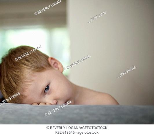 Boy resting on a couch