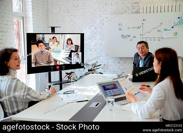 Business team in the conference room open video conference