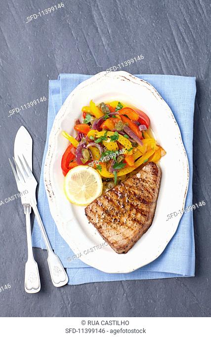 Tuna steak with roasted peppers and capers