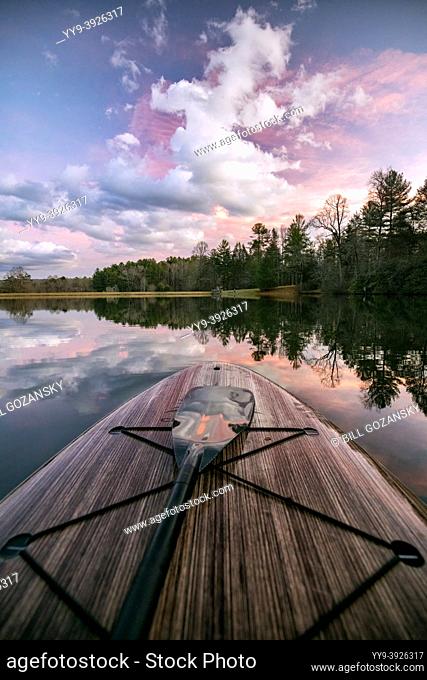 View of Straus Lake at sunset from a paddle board - Brevard, North Carolina, USA