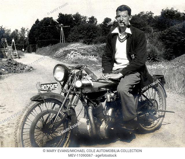 Stylish young man sitting on his 'Special' vintage modified motorcycle in the early 1930s