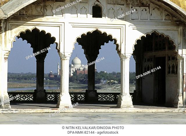 Seventh Wonder of The World 7 Taj Mahal Through arches and pillars of sheesh Mahal , Agra , Uttar Pradesh , india
