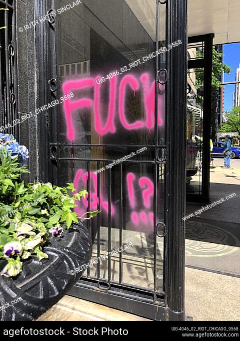 F 12, Graffiti on window of store, aftermath of George Floyd Protest, Chicago, Illinois