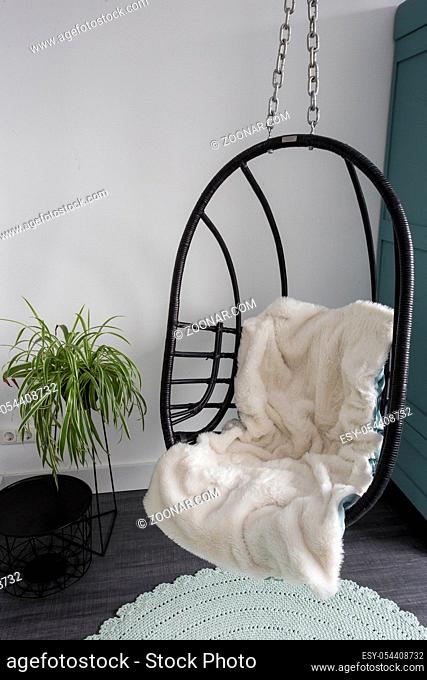 Hanging wicker chairs for relax time in the room, modern design retro