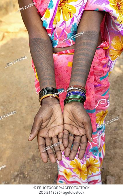 Tattoos painted on the arms of a tribal woman. Santhal tribe. Jarkatand village, Bokaro district, Jharkhand