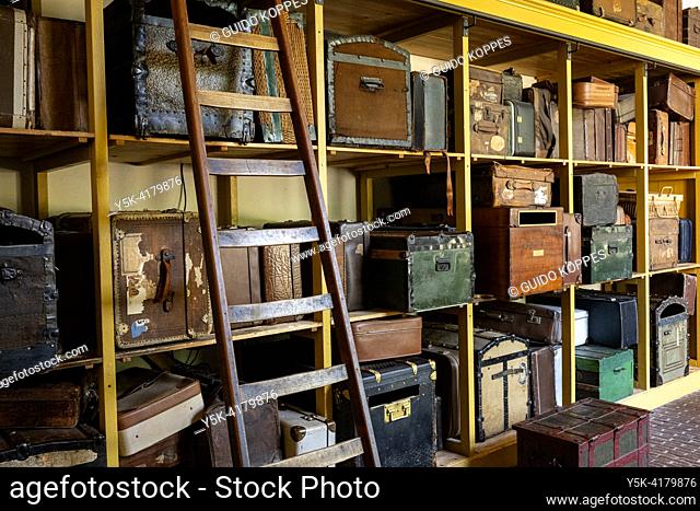 Vintage Luggage & Suitcases at Railway Museum on Racks waiting for Eternal Transport at from the Railroad Museum towards it's Destination
