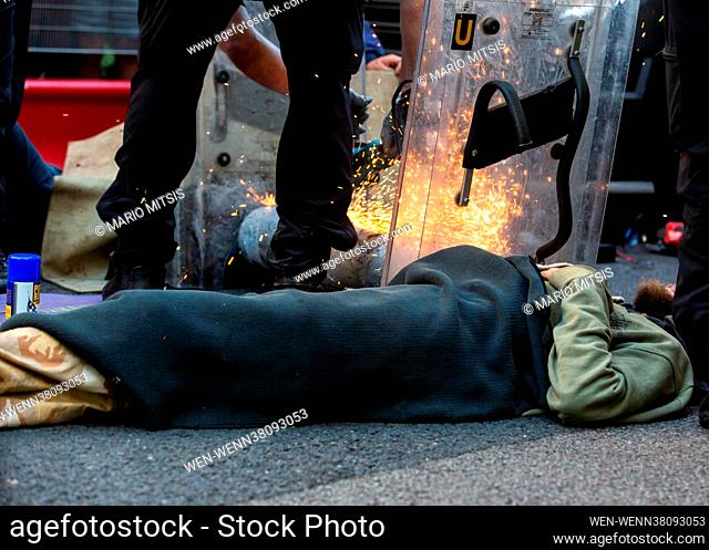 Extinction Rebellion protesters attach themselves to a van. Police team needed to remove them before arrest on the first day of the 'Impossible Rebellion 2021'...