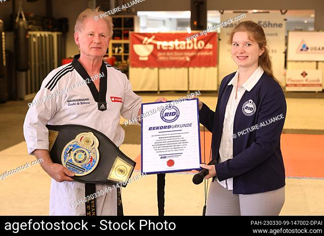 30 March 2023, Hamburg: Muhamed Kahrimanovic presents the certificate at the Record Institute for Germany, which certifies him a world record for smashing 27...