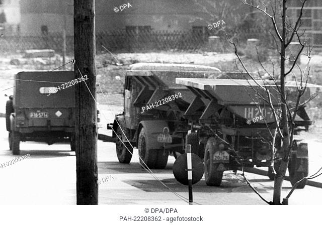 A heavy goods truck with trailer is fed back by a military jeep, after two East Berlin workers used it for their escape to the western part of the city on 9th...
