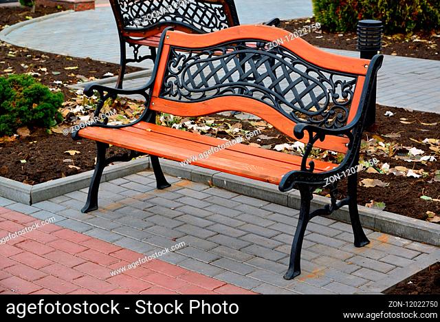 wooden benches with metal back in the park