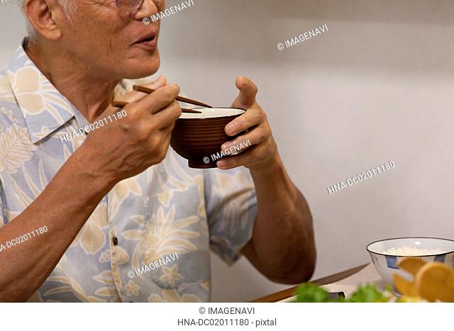 Senior man at a dining table