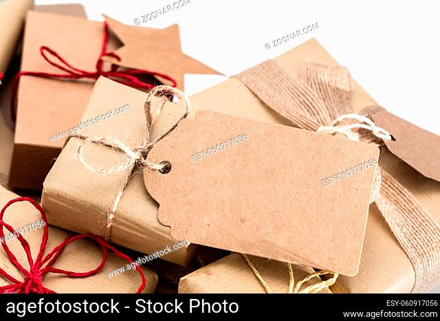 Rustic retro gifts, present boxes with tag for your wishes. Christmas time, vintage mood. Handmade eco paper wrap