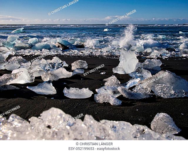 Glacier ice on the coast at the black sandy beach. Photo from March in Iceland