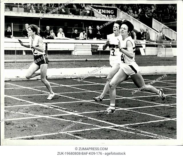 Aug. 08, 1968 - Mary Green wins 400 metres: Mary Green of Great Britain (No.2) breaks the tape to win the Women's 400 metres from fellow countrywomen Janet...