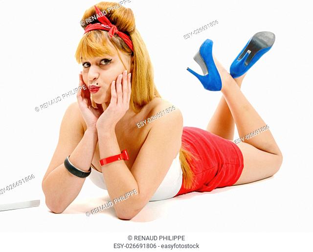 a pretty girl in retro style, lying on the floor