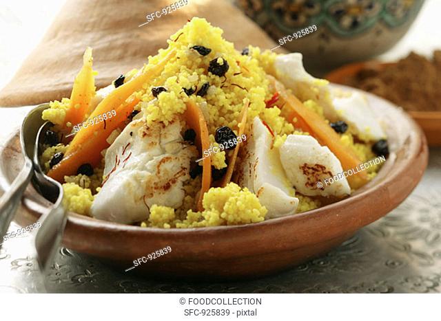 Saffron couscous with fish, carrots and raisins N  Africa