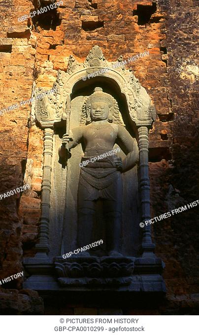 Cambodia: Hindu deity on the wall of one of the six main brick towers, Preah Ko temple, Roluos Complex, Angkor