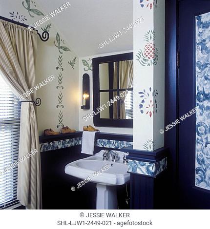 BATHROOMS: Pedestal sink in bath open to bedroom mirror frame was once a window, wall stenciling