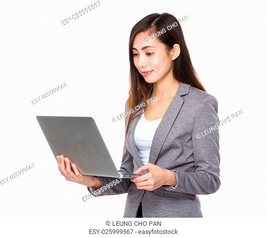 Businesswoman use of the notebook computer