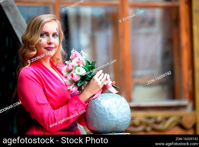 Russia. Moscow, August 27, 2017. Imailovsky park.Brides parade.Beautiful blonde woman with a bouquet of flowers outdoors