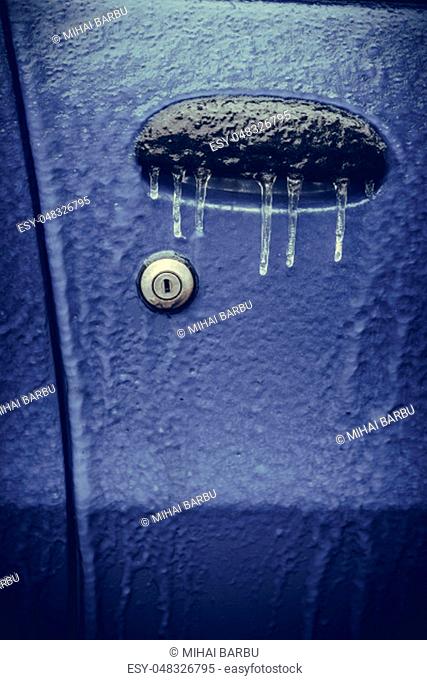 Close up shot of a car's frozen door lock