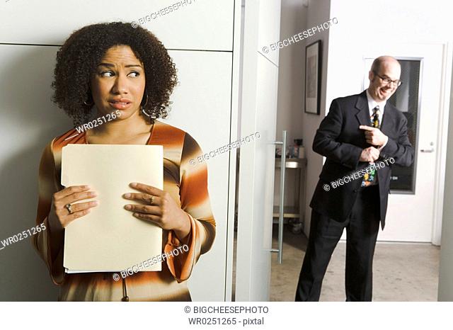 Geeky man pursuing female co-worker