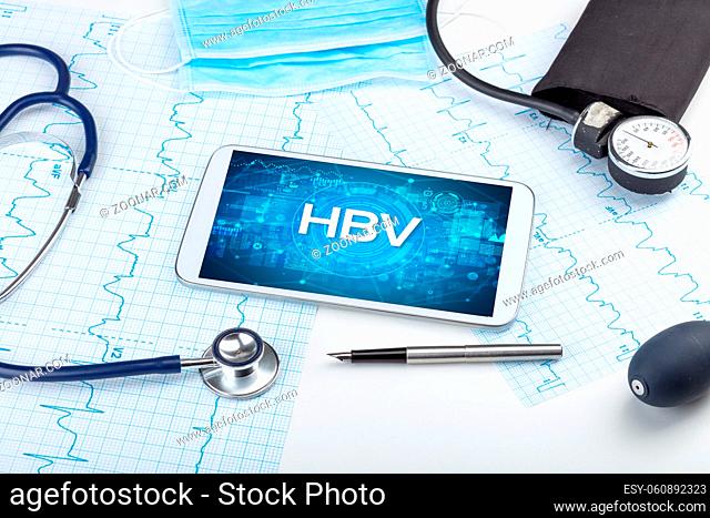 Close-up view of a tablet pc with HBV abbreviation, medical concept