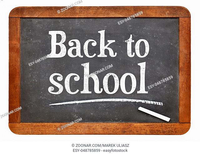 Back to school - white chalk text on a vintage slate blackboard