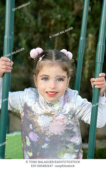 Beautiful caucasian little girl outdoor with asian dress ans makeup