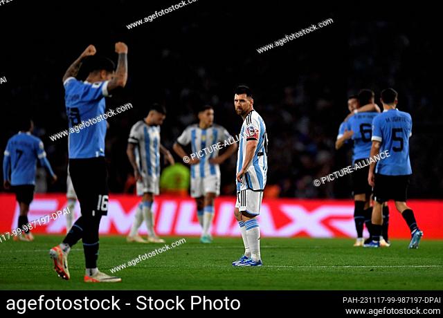 16 November 2023, Argentina, Buenos Aires: Soccer: World Cup qualifier South America, Argentina - Uruguay, matchday 5 at La Bombonera stadium: Lionel Messi (r)