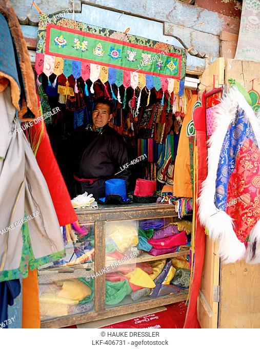 Salesman in his fabric shop, centre of Leh, Ladakh, Jammu and Kashmir, India