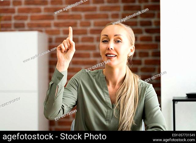 Woman Raising Hand In Training Video Conference Call