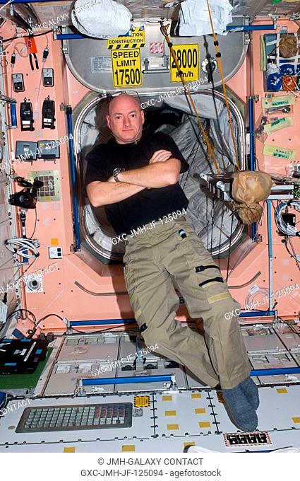NASA astronaut Scott Kelly, Expedition 25 flight engineer, is pictured inside the Unity node onboard the International Space Station some three days after his...