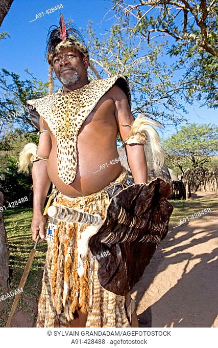 The Chief Biyela dressed with his ceremonial leopard skin. Simunye zulu village where visitors can be accomodated in zulu style