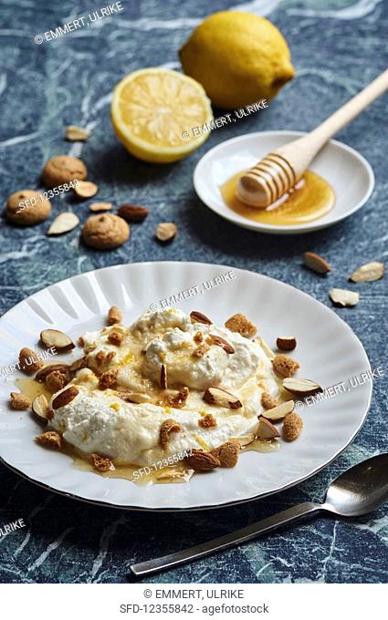 Ricotta pudding with lemon, almonds, amarettini and honey