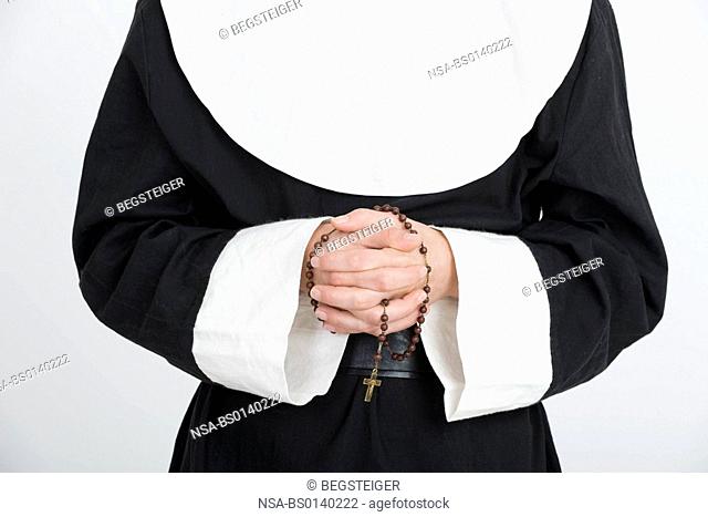 nun says a rosary