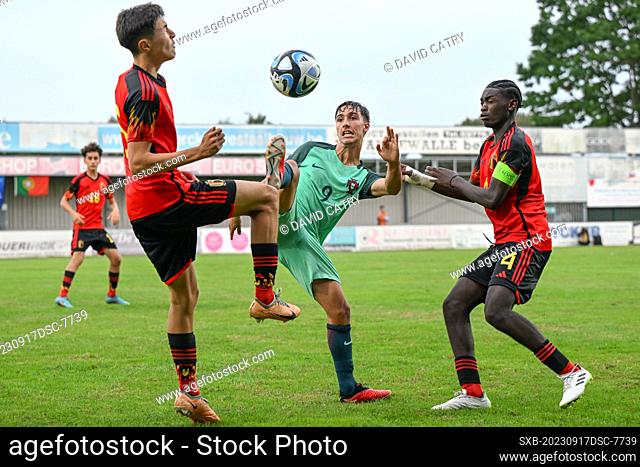 Lucca Darcon (15) of Belgium and Jorthy Mokio (4) of Belgium defending on Tomas Soares (9) of Portugal during a friendly soccer game between the national under...