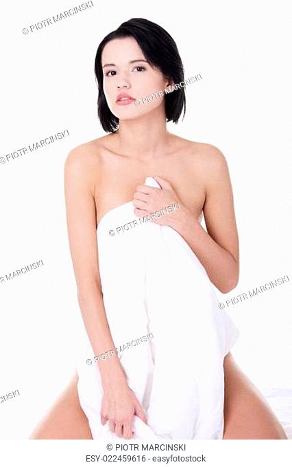 Sexy woman covering her body with sheet