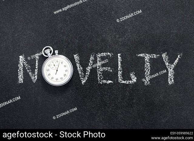 novelty word handwritten on chalkboard with vintage precise stopwatch used instead of O