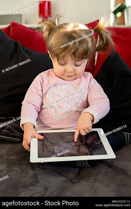Little girl with tablet pc