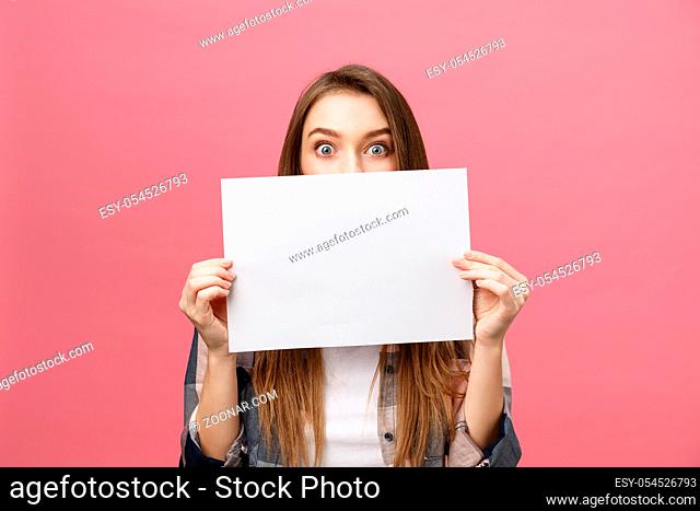 Young caucasian woman holding blank paper sheet over isolated background scared in shock with a surprise face, and excited with fear expression
