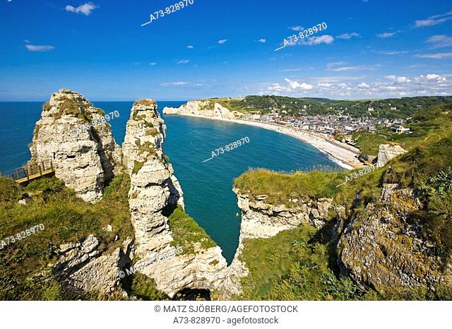 Town and Porte d'Amont cliff as seen from the Porte d'Aval cliff, Etretat. Seine-Maritime, Haute-Normandie, France