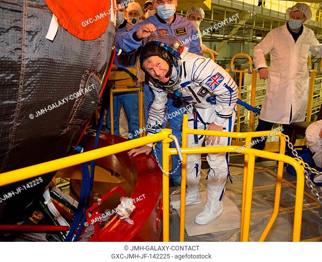 In the Integration Facility at the Baikonur Cosmodrome in Kazakhstan, Expedition 46-47 crewmember Tim Peake of the European Space Agency prepares to board the...