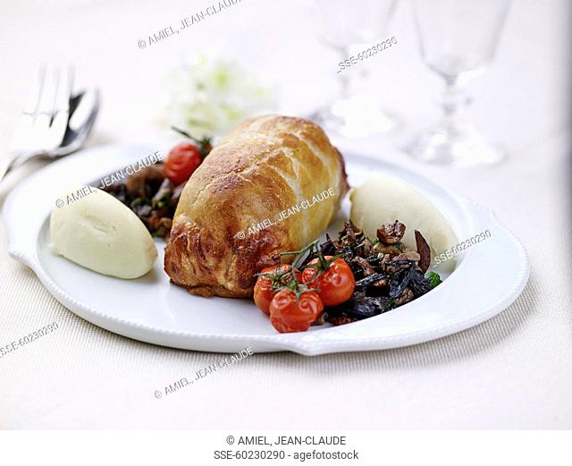 duckling in flaky pastry crust , potato and celeriac mash, mushroom fricassée and roasted tomatoes