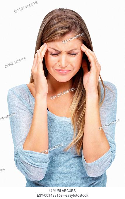Young unhappy woman with severe headache holding forehead in pain