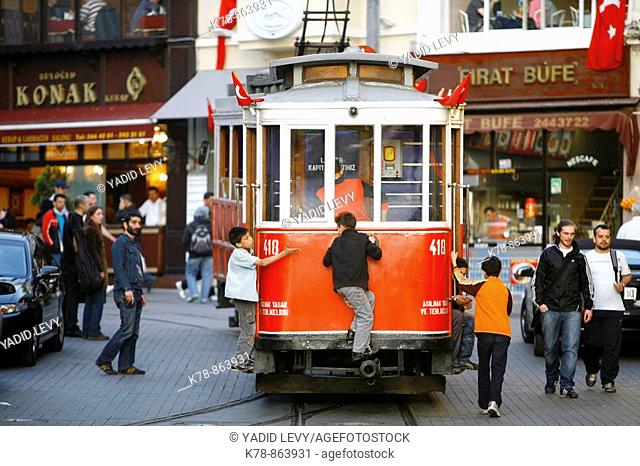 Kids on the tram that goes along Istiklal Caddesi Istanbul's main shopping street in Beyoglu quarter Istanbul, Turkey