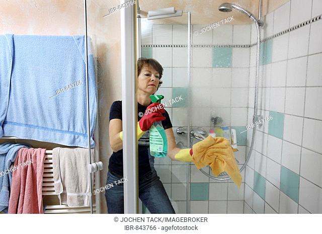 House work, woman cleaning a bathroom