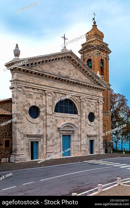 Cloudy autumn day in Tuscany. The small town of Montalcino. Beautiful facade and bell tower of the church. The concept of cognitive, active and photo tourism